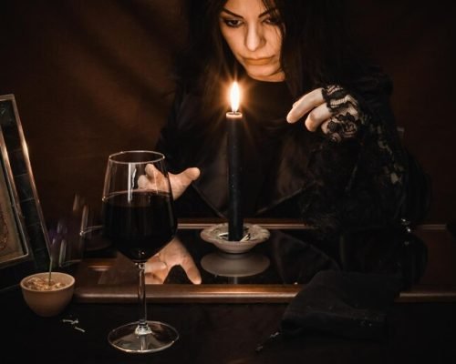 midsection-woman-holding-wine-glass-while-making-magic-ritual_1048944-7778267